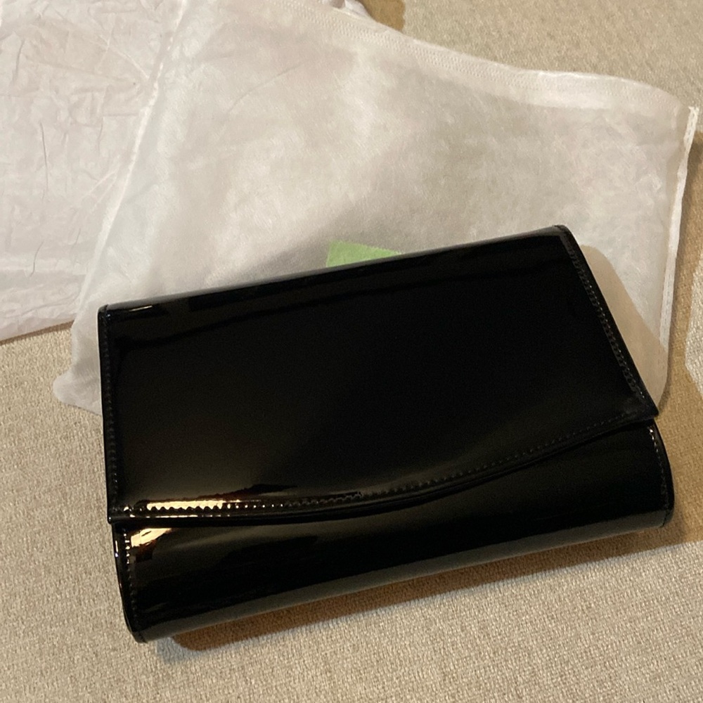 NEW in package black patent evening bag by Charming Tailor. Chain length 48"